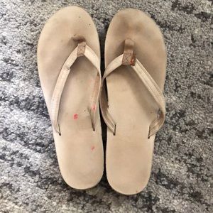 Tan rainbow flip flops